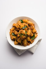 Kaccha Papita Sabji or Raw Papaya Sabzi, served in a karahi or bowl. selective focus