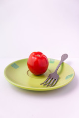 apple on plate with fork and knife