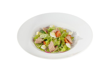 Caesar salad with tuna, tomato, onion, egg, olives, lettuce on plate, white isolated background, Side view. For the menu, restaurant bar cafe