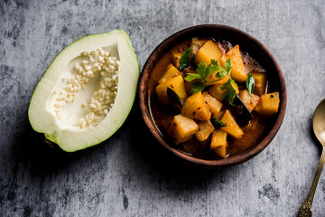Kaccha Papita Sabji or Raw Papaya Sabzi, served in a karahi or bowl. selective focus