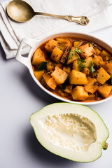 Kaccha Papita Sabji or Raw Papaya Sabzi, served in a karahi or bowl. selective focus