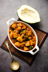 Kacha Papita sabzi with gravy or Raw Papaya curry Sabji , served in a bowl. selective focus