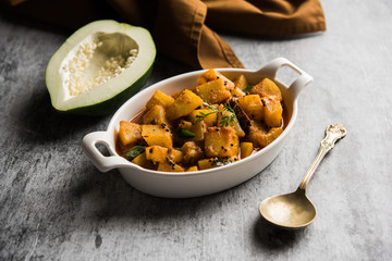 Kacha Papita sabzi with gravy or Raw Papaya curry Sabji , served in a bowl. selective focus