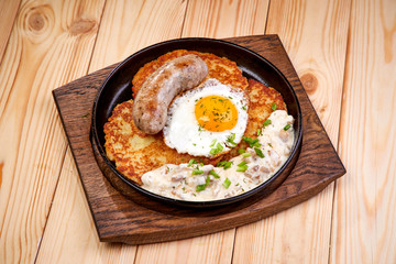 potato pancake with egg and sausage