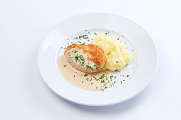 cutlet with mashed potato on the white background