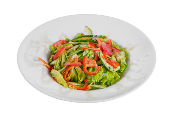 Vegetable salad with lettuce, cucumber, tomato, bell pepper, oil on plate, white isolated background Side view. For the menu, restaurant bar cafe