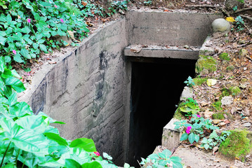 Old abandoned bomb shelter. Old dugout.