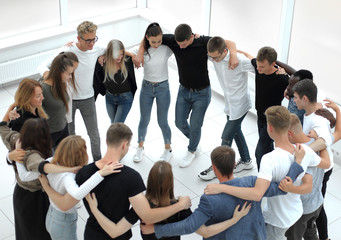 Fototapeta premium group of casual young people standing in a circle
