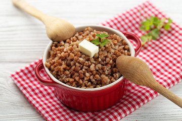 Buckwheat porridge with butter in bawl - breakfast, healthy food