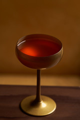 Classic cocktail glass on wood table in night club restaurant