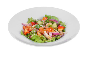 Vegetable salad with lettuce, red onion, cucumber, tomato, bell pepper, oil on plate, white isolated background Side view. For the menu, restaurant bar cafe