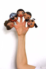 A puppet show for the fingers of a mask on a person’s head. The doll wears on the fingers of a human hand, and everything is depicted on a white background. International Puppet Theater Day.