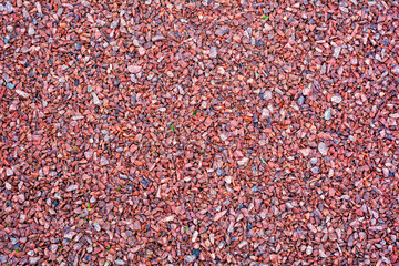 Red, white granite fine gravel, simple stone background, pebbles stone texture