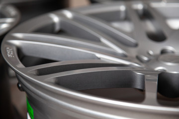 Beautiful alloy car wheels in forged aluminum with knitting needles and titanium silver. Auto...