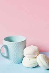 Cup of tea and marshmallows on the table. Food photography