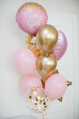 Pink and golden balloons with text 