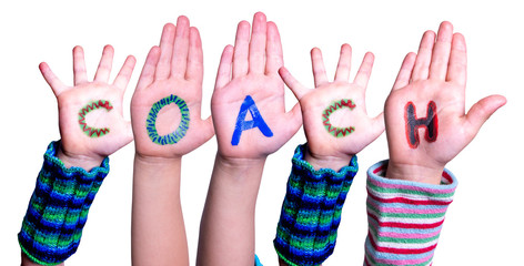 Children Hands Building Colorful Word Coach. White Isolated Background