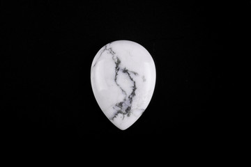 Cabochons made of natural stone on a black background