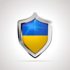 Fototapeta premium Ukraine flag projected as a glossy shield on a white background