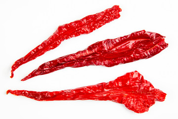 Dried hot red pepper on a white background. Food and spices.