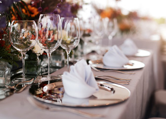 Table setting for a wedding or dinner event, with flowers