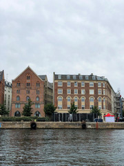 Fototapeta na wymiar Buildings on the waterfront on the canal at Copenhagen in Denmark