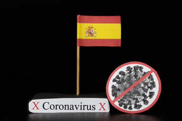 Flag of Spain with cell of Covid-19 type which is of a group of RNA viruses. Pandemic disease on the same basis as the flu. Spain is another country where the number of infected people increases