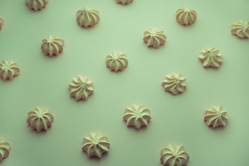 Small meringue even rows over light background