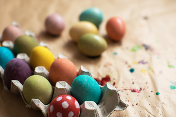 Fototapeta na wymiar Colored easter eggs on table. Happy Easter!