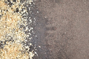 texture of gray asphalt and wood shavings