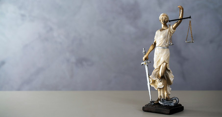 Themis. Law and Jusitce concept photo, grey stone background