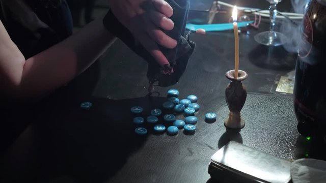 The witch lays out tarot cards. Conducts a spiritualistic session, looks at the future. Engaged in black magic, associated with the spirits and souls of dead. Otherworldly forces, anamalous activity