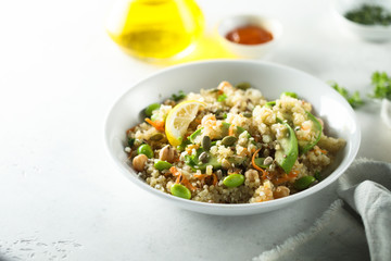 Healthy quinoa bowl with soy beans and avocado