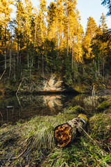 Sand stone cliffs and small river with beutiful reflection in sunset time.