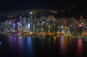 Cityscape orange illuminated Hong Kong districts at night