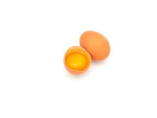 Fresh half-cracked egg isolated on a white background.  High protein and vitamins, Concept of healthy.