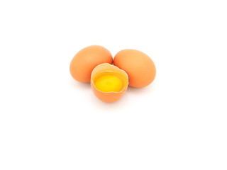 Fresh half-cracked egg and two isolated on a white background. The concept of a high protein and vitamin diet can be eaten every day.