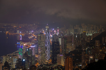 Fototapeta na wymiar Cityscape Hong Kong buildings with flashing lights at night