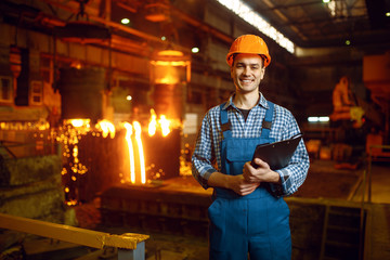 Master at furnace with liquid metal, steel factory