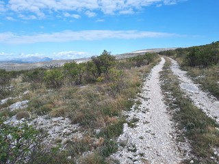 Panoramic view of rural area near mountain and cirrus clouds
