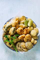 Deep frying vegetables in a plate on the table. vegan option
