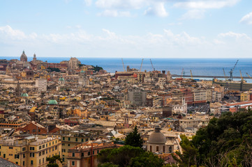 Fototapeta na wymiar Top aerial scenic panoramic view from above of old historical centre quarter districts of Genoa (Genova), port and harbor of Ligurian and Mediterranean Sea, Liguria, Italy.