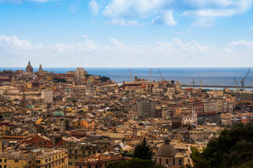 Fototapeta na wymiar Top aerial scenic panoramic view from above of old historical centre quarter districts of Genoa (Genova), port and harbor of Ligurian and Mediterranean Sea, Liguria, Italy.