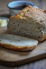 Sliced boule bread with butter