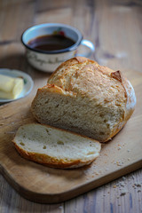 Sliced boule bread with butter