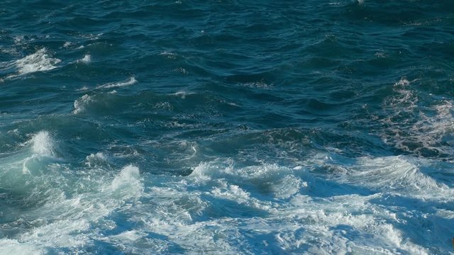 Waves of Ocean Water crash on the rocks of the Volcanic island of Tenerife Beginning of Life in Sea Tide turns into pearl drops and splashes Waves reflect the sun's rays shot 4.6K