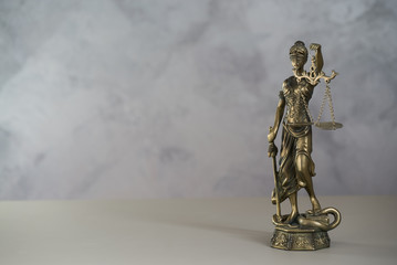 Themis. Law and Jusitce concept photo, grey stone background