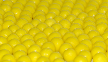 Selective focus of yellow round dragees of ascorbic acid vitamin C 