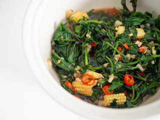 Stir Fried Vegetable with Oyster Sauce Put the baby corn,pepper, garlic, soy sauce into the white background tile bowl.