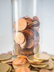 Thai Baht Coins colors Gold set in the mountains,Is the currency of Thailand.For business expenses,Coin is in a jar of money saving,White background